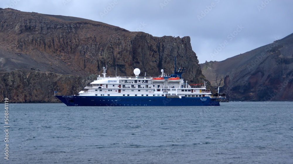 Expedition cruise ship at Whaler's Bay, Deception Island, Antarctica Expedition cruise ship at Whaler's Bay, Deception Island, Antarctica