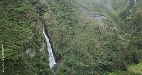 Aerial view of a waterfall in the Peruvian Andes. Fresh water source from high mountain.