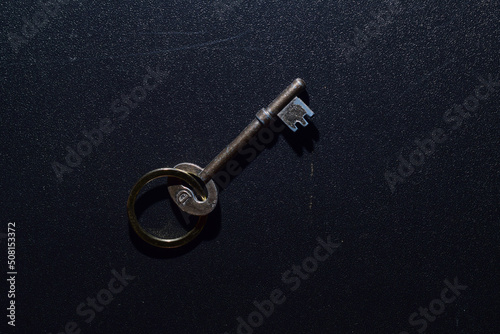 Key on dark gray background with pattern © chunyawut