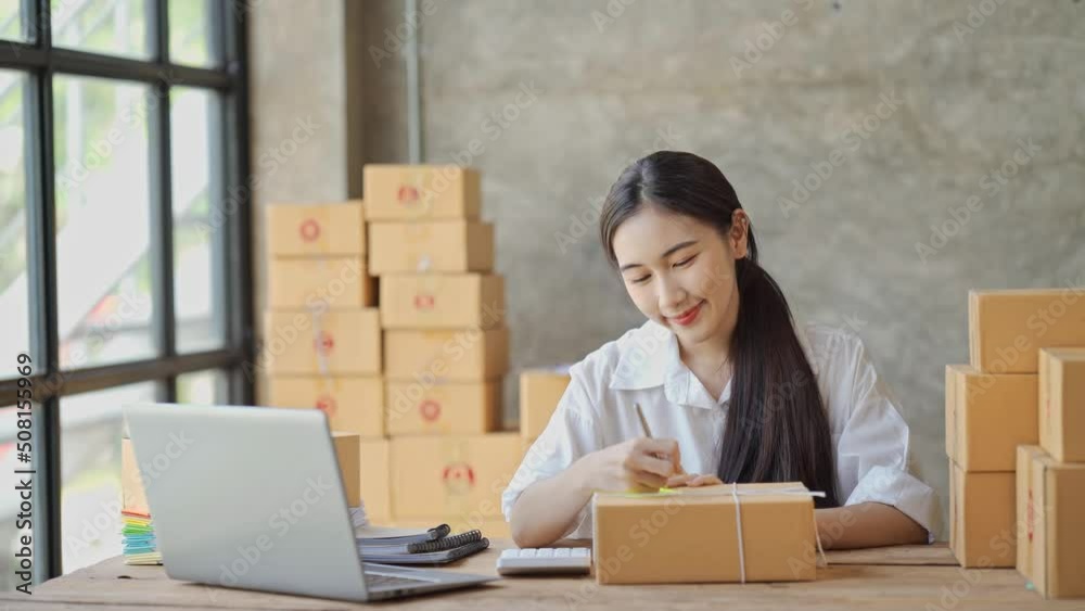 Starting small businesses SME owners female entrepreneurs check online orders to prepare to pack the boxes, sell to customers, sme business ideas online. Starting small businesses SME owners female entrepreneurs check online orders to prepare to pack the boxes, sell to customers, sme business ideas online.
