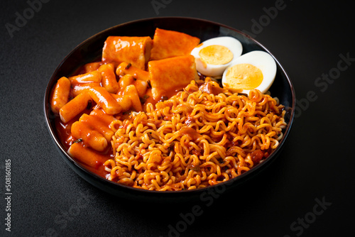 Korean instant noodles with Korean rice cake and fish cake and boiled egg photo