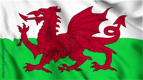 Wales national flag is waving in the seamless video. Animated wales flag video. Close up wales national flag. Smooth fabric waves.  photo
