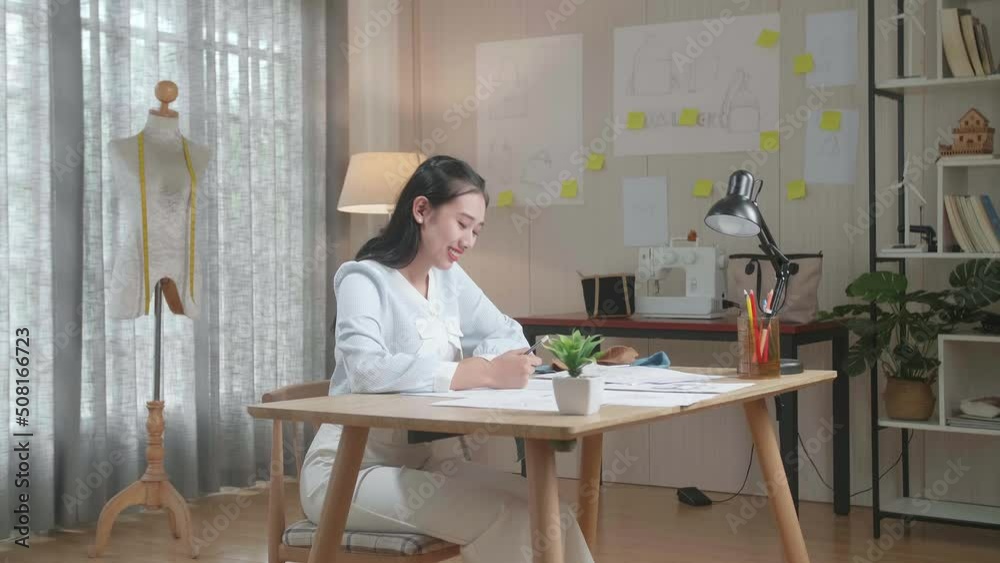 Asian Woman Designer With Layout Bond Smile To Camera While Working With Laptop At The Office
Asian Woman Designer With Layout Bond Smile To Camera While Working With Laptop At The Office