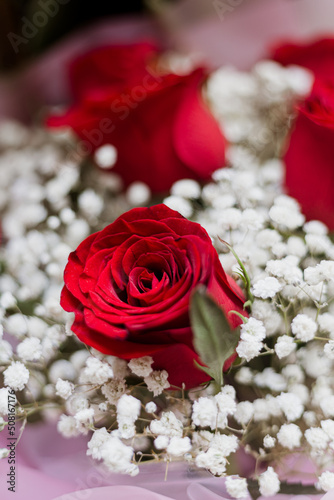 bouquet of red roses and white baby s breath