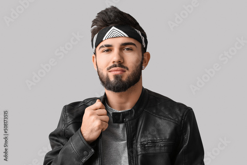 Young bearded man adjusting...