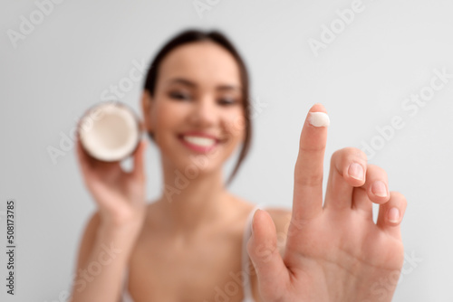 Young woman with coconut an...