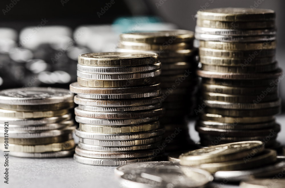 Lots of coins. The concept of investing or saving money or a financial crisis Lots of coins. The concept of investing or saving money or a financial crisis