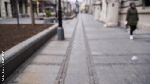 Slow motion blurred video on city street. Urban alley. Empty crosswalk. Social distance concept. Road corner. Lifestyle daytime background. Europe town exterior