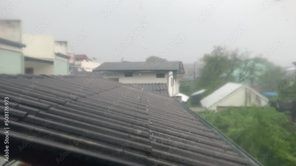 Heavy rain, storm and windy on the roof.