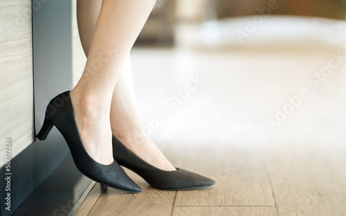 Black high heel shoes fashion woman. beautiful sexy legs. Close up of business woman walking away.