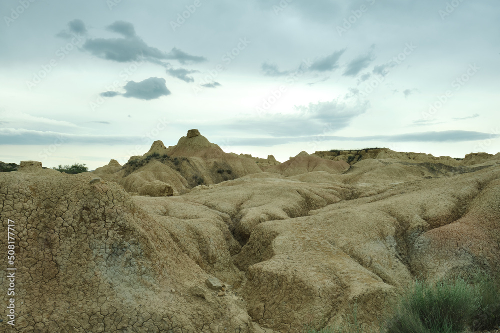 Bardenas Reales Natural Park with a semi-desert landscape with rock formations of clay, gypsum and sandstone, eroded by wind and rain, Bardenas Blancas area. Navarre, Spain
