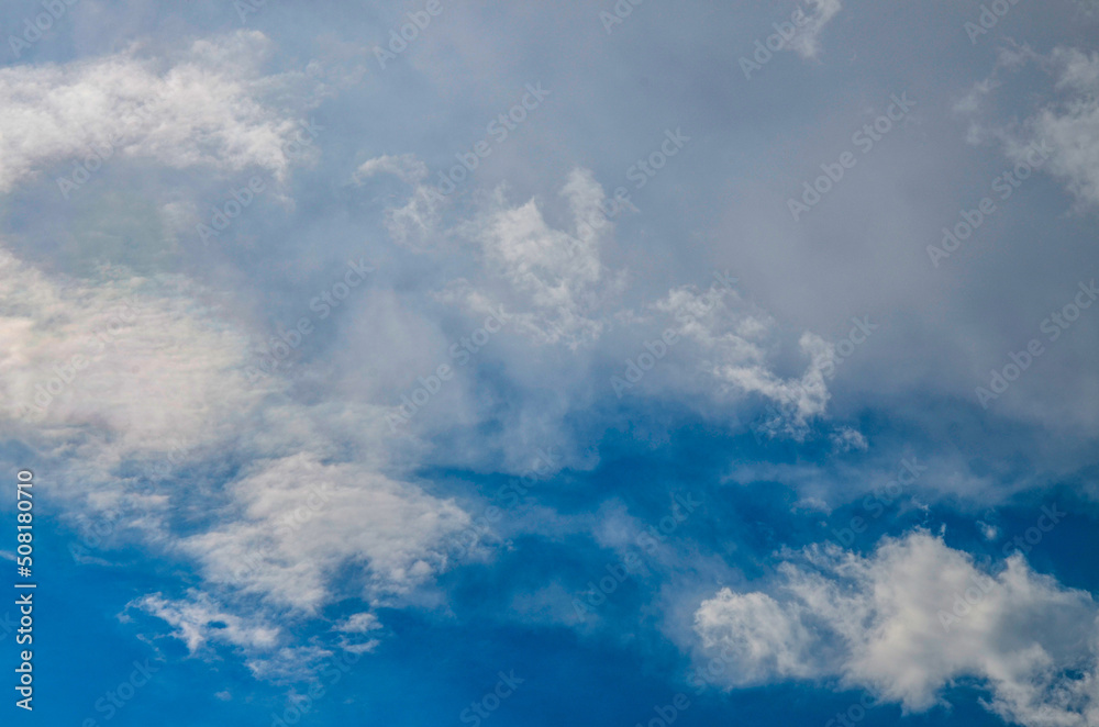 Blue beautiful sky with white clouds in sunny day