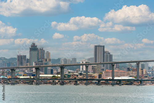 Cebu City, Philippines - The uptown cebu skyline as seen from a passing ship. Part of CCLEX highway visible in photo. photo