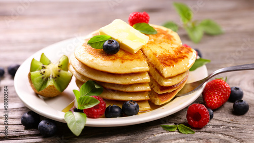 stack of pancakes with berries fruits