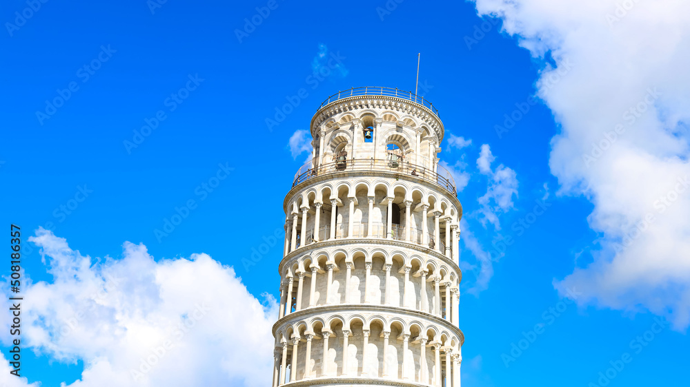 Building of the Leaning Tower of Pisa on a clear day with white clouds in the sky background-Travel landmark concept