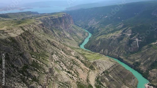 Sulak canyon - the deepest canyon in Europe on a sunny summer day. The turquoise waters of the Sulak River flow through the gorge. Tourist attraction. The Republic of Dagestan. Drone view. photo