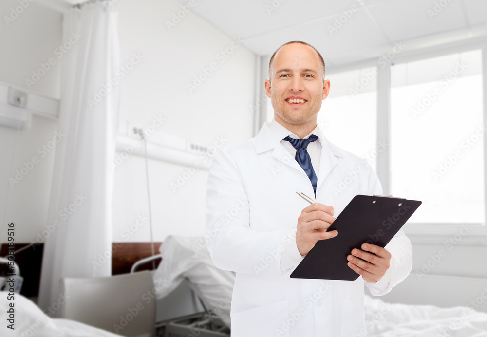 medicine, profession and healthcare concept - smiling male doctor with clipboard writing prescription over hospital ward background medicine, profession and healthcare concept - smiling male doctor with clipboard writing prescription over hospital ward background
