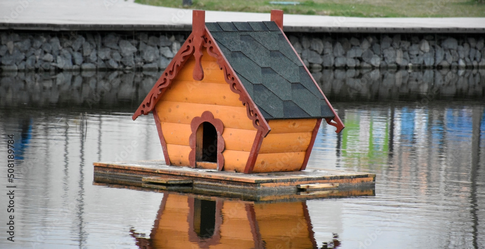 A duck house on the pond