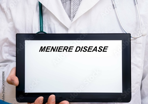Meniere Disease.  Doctor with rare or orphan disease text on tablet screen Meniere Disease photo