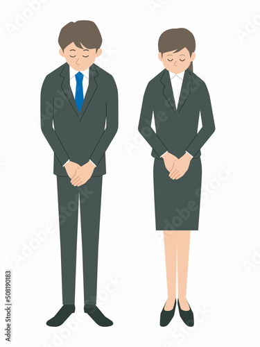 お辞儀をするビジネスパーソン　男女