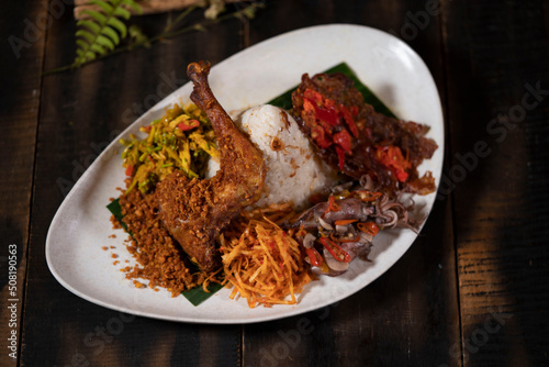 Nasi gurih is an Indonesian steamed rice cooked in coconut milk and spices dish originally from Aceh, Indonesia.