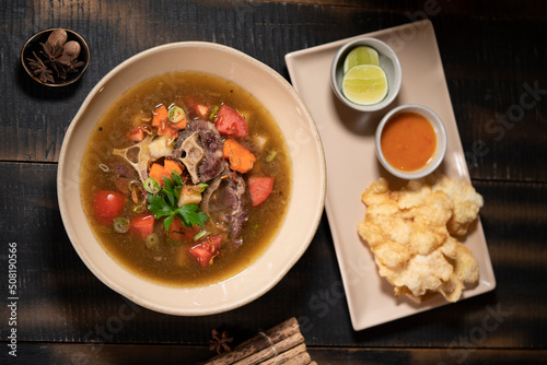 Indonesian Food: Oxtail Soup or Sop Buntut is a comforting soup with oxtails being cooked to the point of almost falling off the bones in aromatic spices and chunky vegetables.