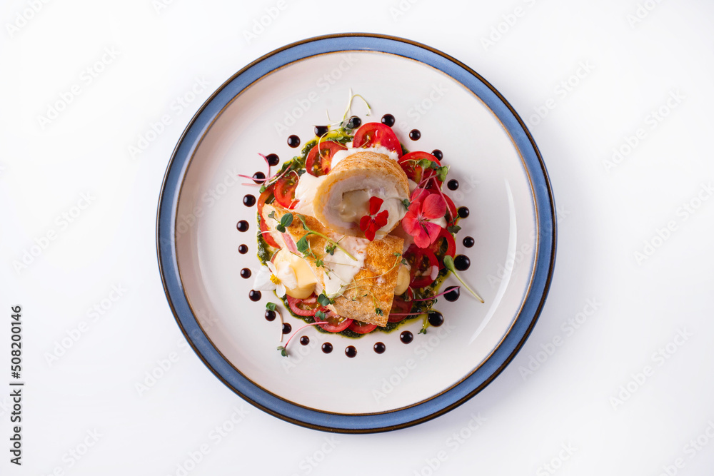 meatloaf with cheese filling and tomatoes. on a white background meatloaf with cheese filling and tomatoes. on a white background