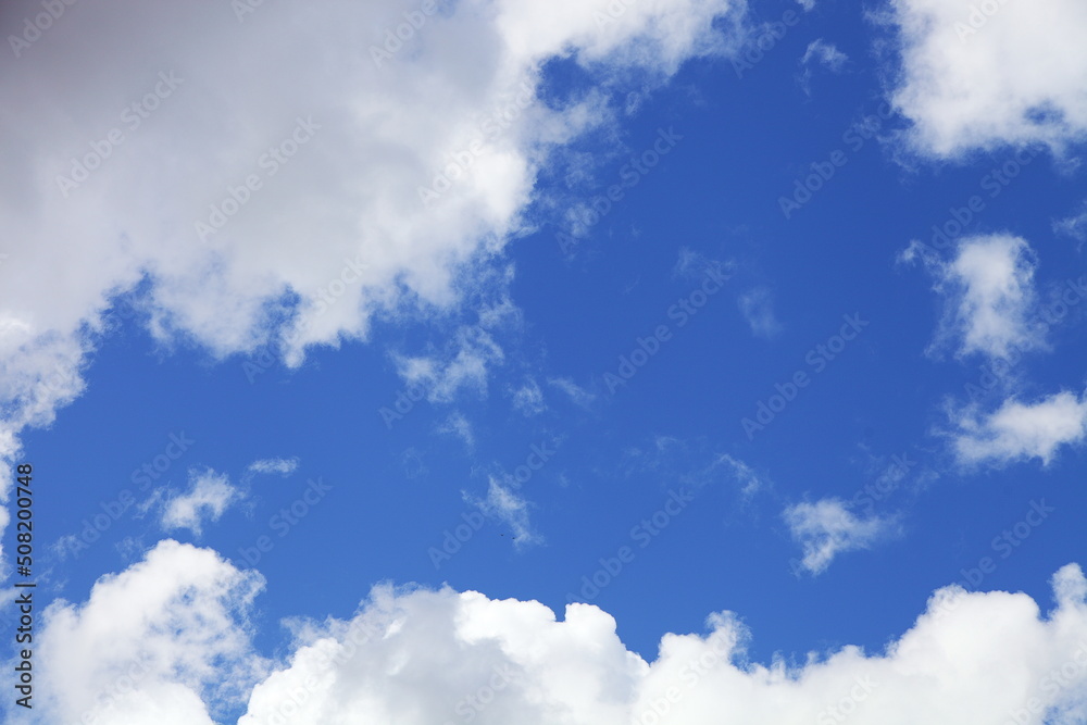 Obraz premium Beautiful blue sky with white clouds.