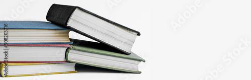 Stack of books on white background with copy space