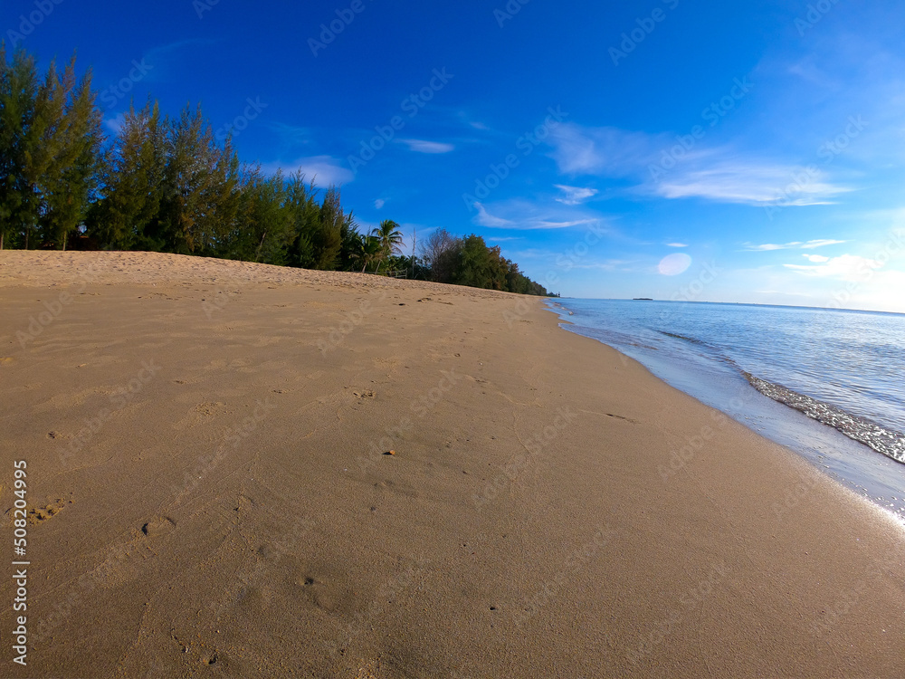 Beach umbrella with blue sky on tropical beach.Bayview Becach Bankrut Prajuabkerekaan,Southern of Thailand Beach umbrella with blue sky on tropical beach.Bayview Becach Bankrut Prajuabkerekaan,Southern of Thailand