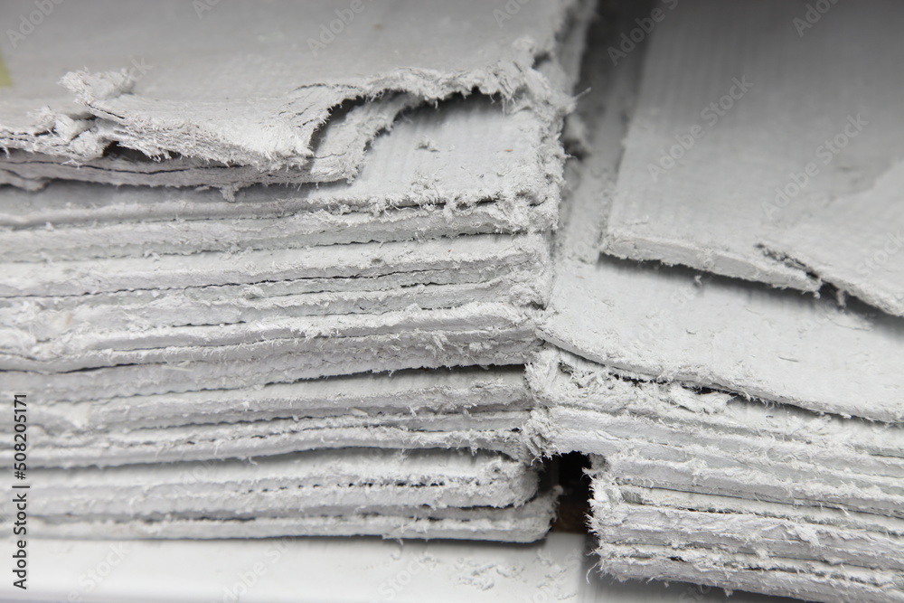 Asbestos sheets in stack - effective insulator for construction