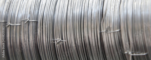 Binding wires skeins for rebar strapping in building concrete construction - industrial wide background texture