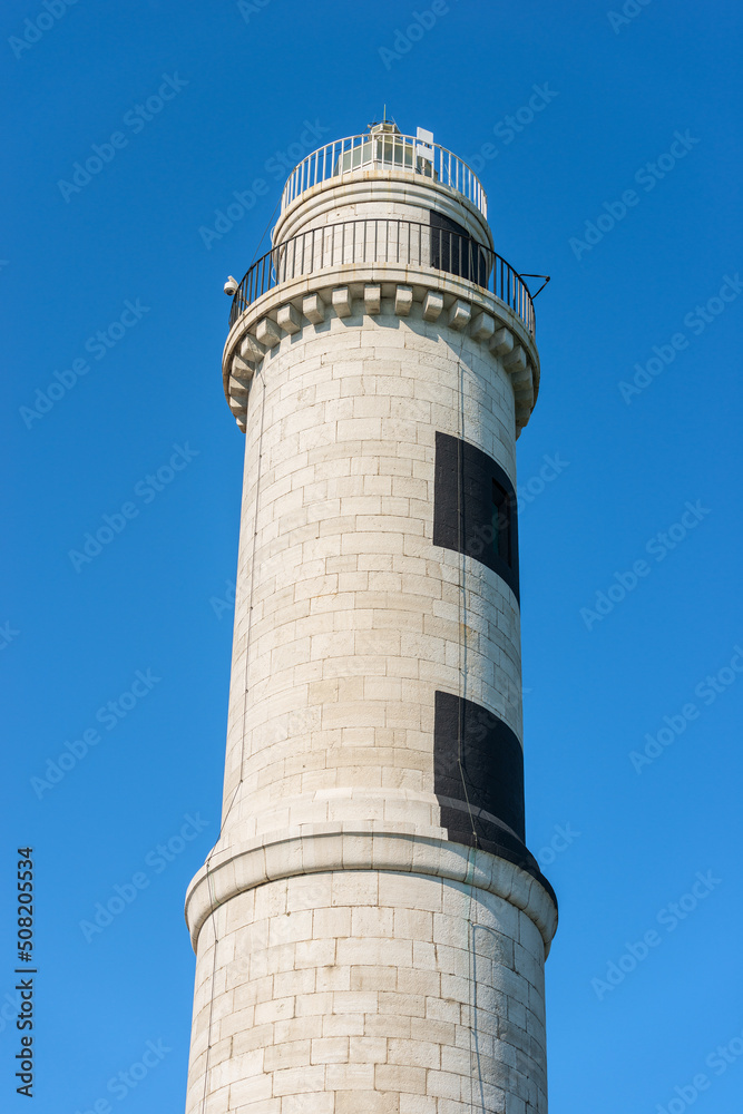 The ancient lighthouse of the island of Murano made of white and black stones, 1934. Punta Faro, Venetian lagoon, Venice, UNESCO world heritage site, Veneto, Italy, Europe. 
