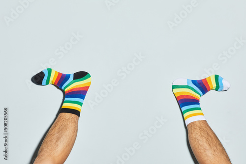 Canvastavla Minimal shot of playful man wearing mismatched socks feet up, copy space