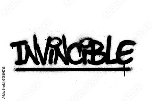 Graffiti invincible word sprayed in black over white