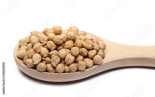 Raw chickpeas pile in wooden spoon isolated on white  