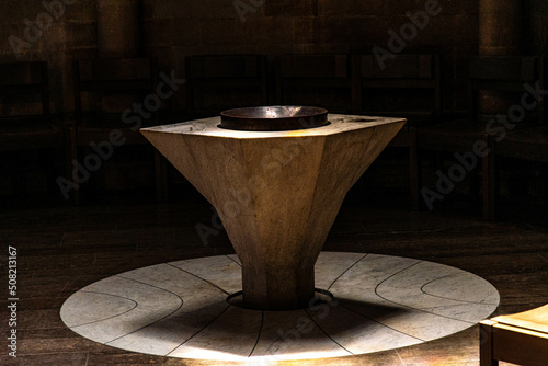 Baptismal font with available light in the church