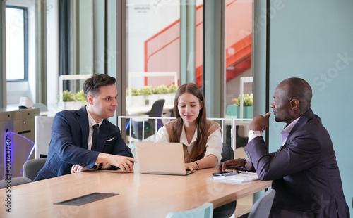 Business people in the workplace are discussing a working strategy for doing business