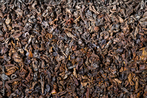Dried black tea leaves close up as a background. Flower tea, useful herbs for brewing a drink.