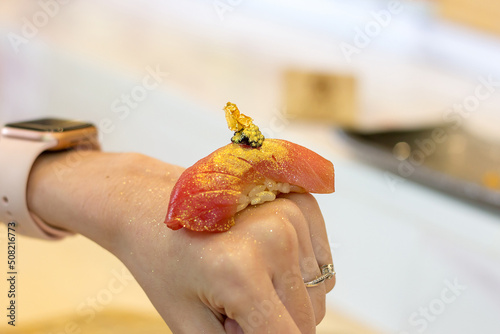 Golden leaf and caviar on fattty blue fin tuna sushi, Chutoro Nigiri photo