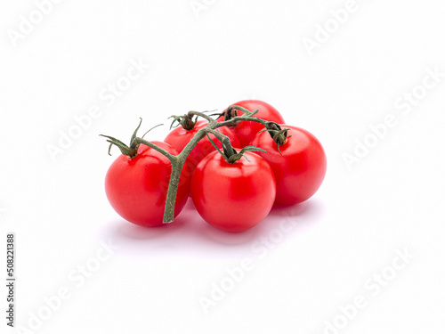 Red ripe fresh cherry tomatoes over a white background