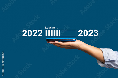 Countdown to 2023 concept. The virtual download bar with loading progress bar for New Year's Eve and changing the year 2022 to 2023 photo