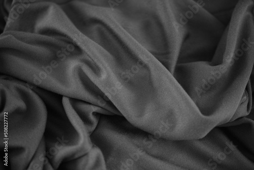 A crumpled fabric texture background. Black and white. Close up.