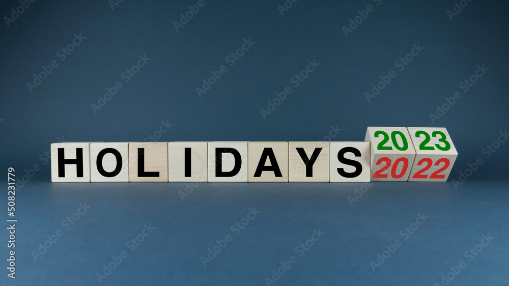 Cubes form the words Holidays 2022 2023. The concept and planning of