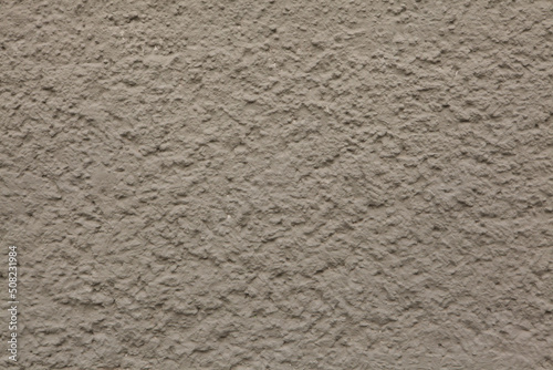 Dirty brown painted stucco wall. Background texture