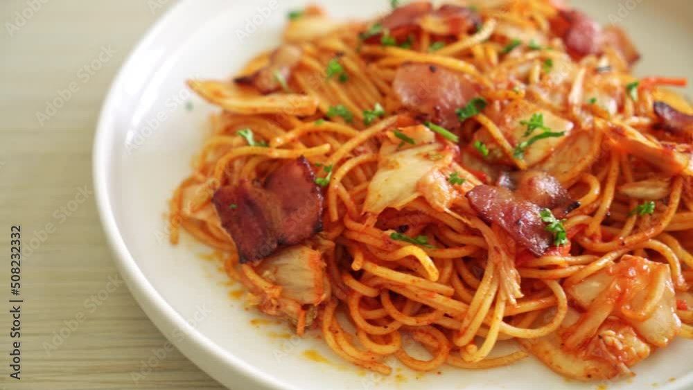 stir-fried spaghetti with kimchi and bacon - fusion food style stir-fried spaghetti with kimchi and bacon - fusion food style