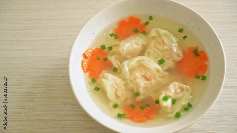 shrimp dumpling soup in white bowl - Asian food style shrimp dumpling soup in white bowl - Asian food style