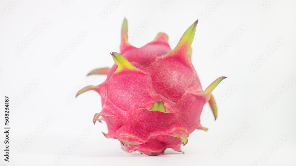 RED PITAHAYA DRAGÓN FRUIT ON A WHITE BACKGROUND WITH SPACE FOR TEXT, HEALTHY DIET WITH EXOTIC TROPICAL FRUITS RED PITAHAYA DRAGÓN FRUIT ON A WHITE BACKGROUND WITH SPACE FOR TEXT, HEALTHY DIET WITH EXOTIC TROPICAL FRUITS