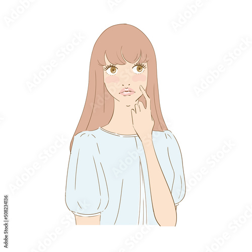 頬を指差す困り顔の美しい女性