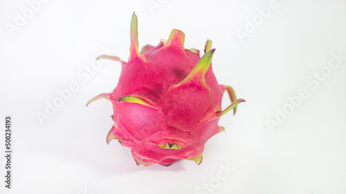 RED PITAHAYA DRAG  N FRUIT ON A WHITE BACKGROUND WITH SPACE FOR TEXT  HEALTHY DIET WITH EXOTIC TROPICAL FRUITS